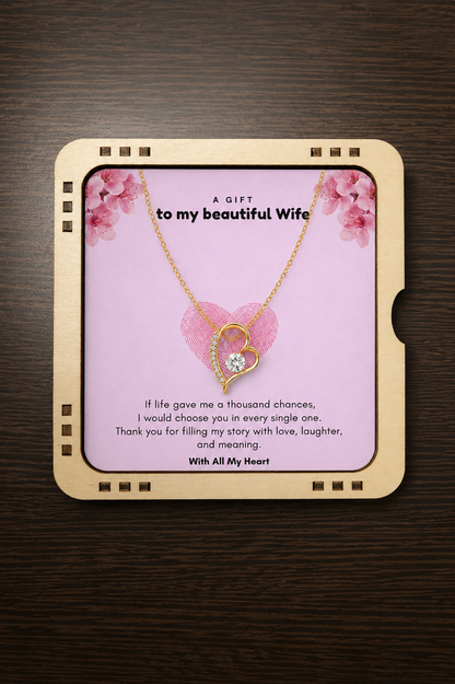 Elegant open-heart necklace with clear stone displayed on a floral gift card for wife.
