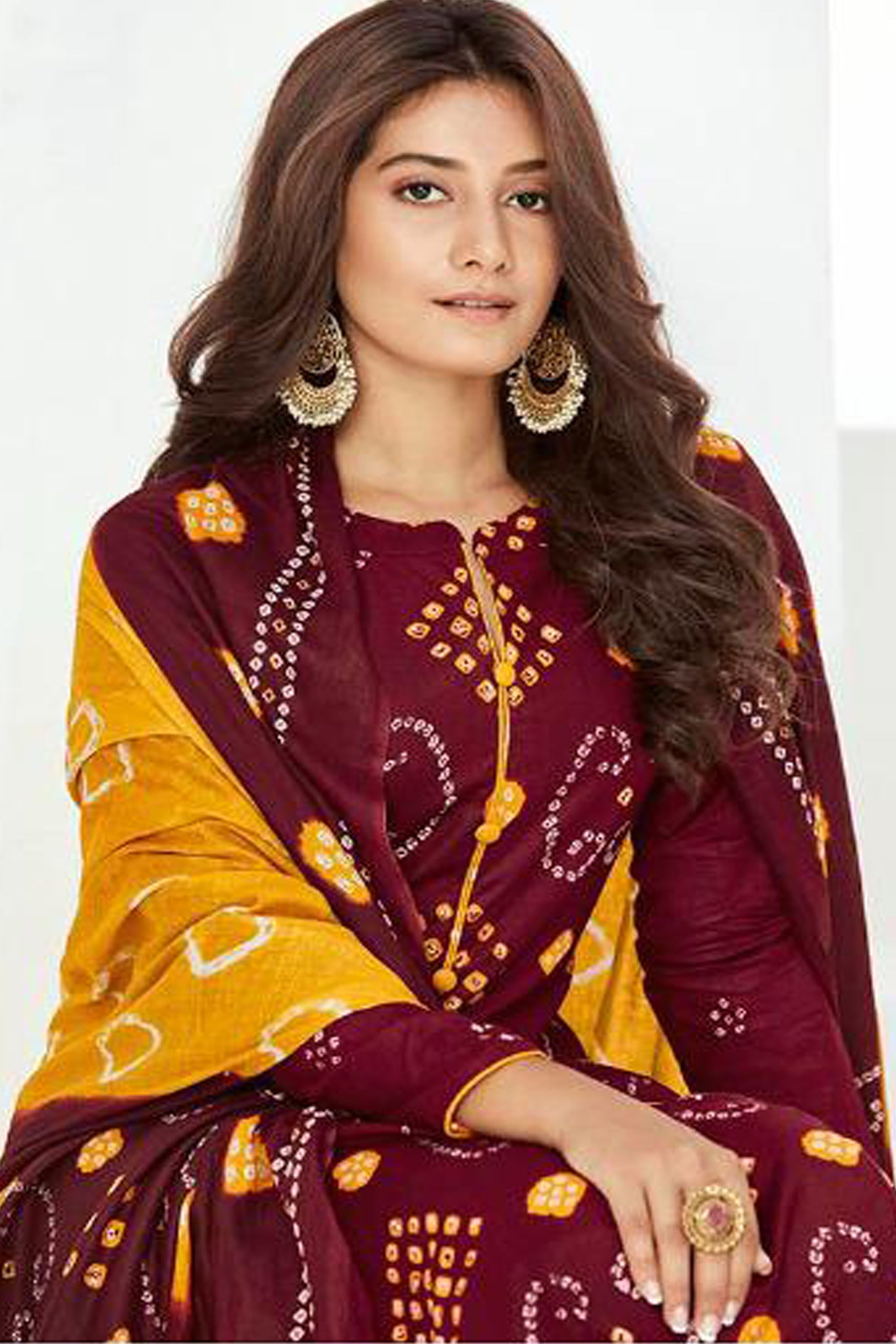 Embroidered floral work on wine cotton salwar kameez.