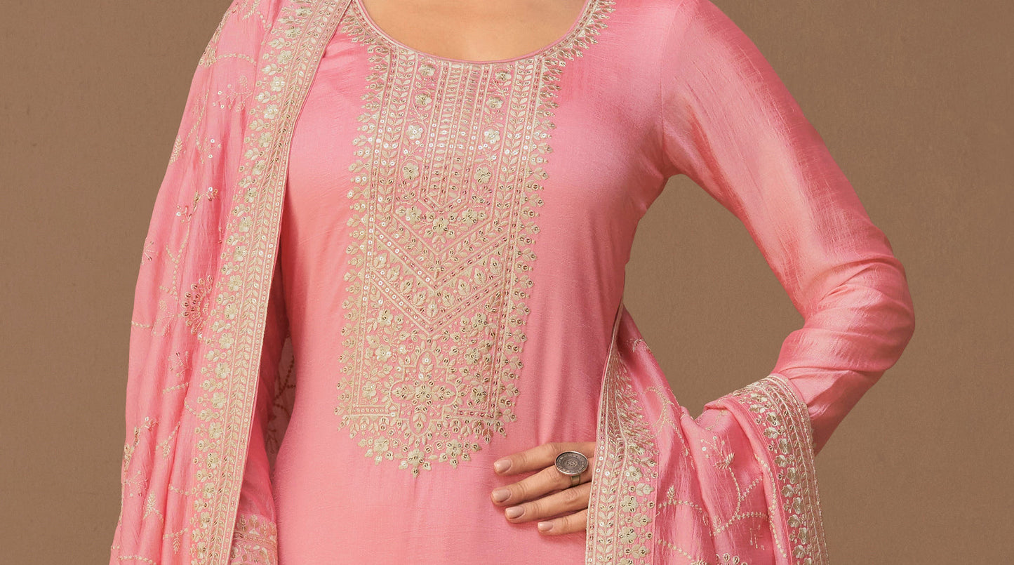 Close-up of premium silk fabric texture in pink salwar suit
