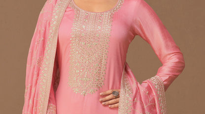 Close-up of premium silk fabric texture in pink salwar suit